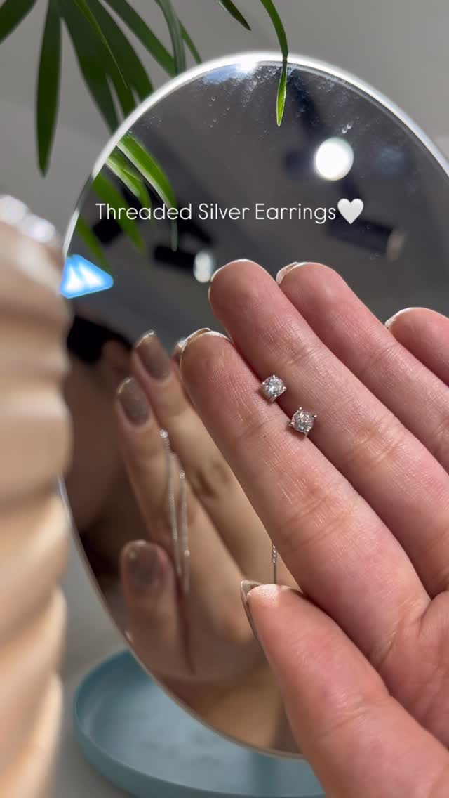 Unique silver earring designed to thread through your ears - View 1