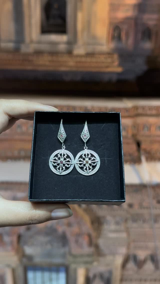 Handmade in silver the Bishwa Bajra earrings reflect strength and heritage. - View 1
