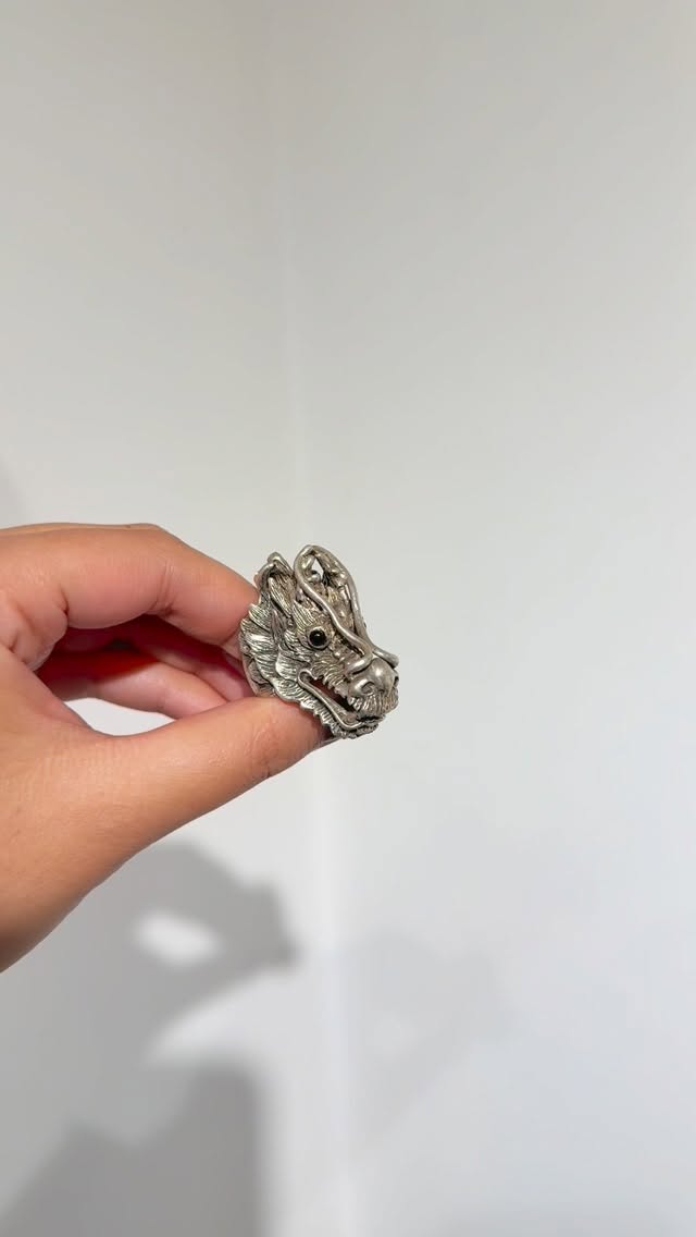 A dragon ring handmade in silver holding myth in every scale. - View 1